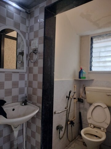 Bathroom in 1 BHK Apartment at New Jay Palace, Yari Road – for Rent
