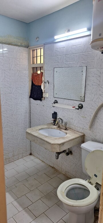 Bathroom in 3 BHK Apartment at Smiriti Apartment, Sector 56 – for Sale