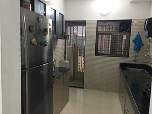 Kitchen in 2.5 BHK Apartment at Sudarshan Sky Garden, Ghodbunder Road – for Sale