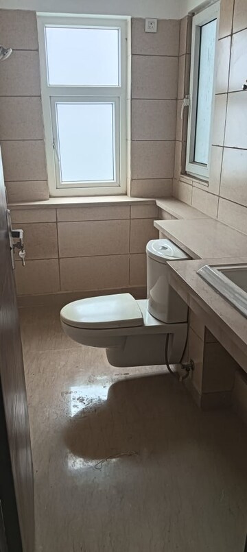 Bathroom in 4 BHK Apartment at Puri Diplomatic Greens Phase I, Sector 111 – for Rent