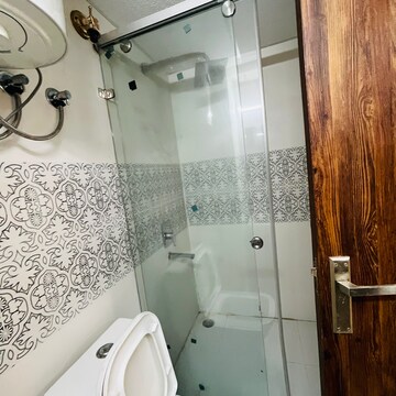 Bathroom in 3 BHK Apartment at Uninav Bliss, Raj Nagar Extension – for Rent