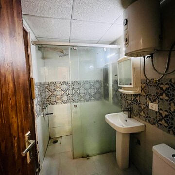 Bathroom in 3 BHK Apartment at Uninav Bliss, Raj Nagar Extension – for Rent