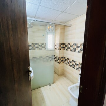 Bathroom in 3 BHK Apartment at Uninav Bliss, Raj Nagar Extension – for Rent