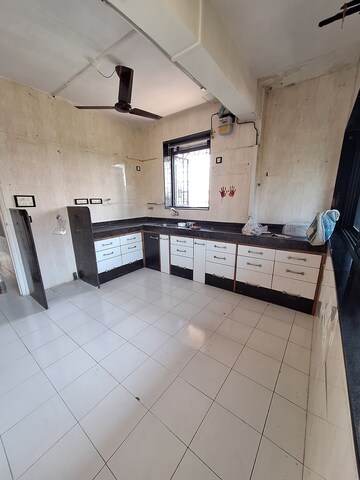 Kitchen in 2 BHK Apartment at Dadarkar Building, Dadar West – for Rent