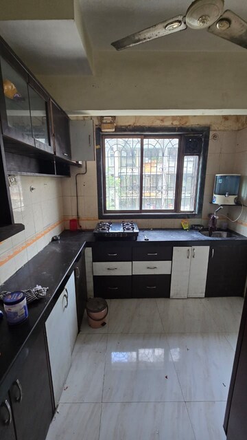 Kitchen in 1 BHK Apartment at Narmada Kunj CHS, Kharghar – for Rent