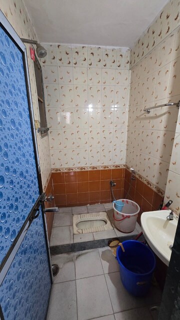 Bathroom in 1 BHK Apartment at Narmada Kunj CHS, Kharghar – for Rent