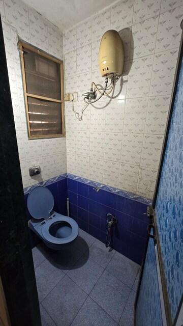 Bathroom in 1 BHK Apartment at Narmada Kunj CHS, Kharghar – for Rent