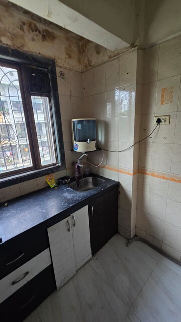 Kitchen in 1 BHK Apartment at Narmada Kunj CHS, Kharghar – for Rent