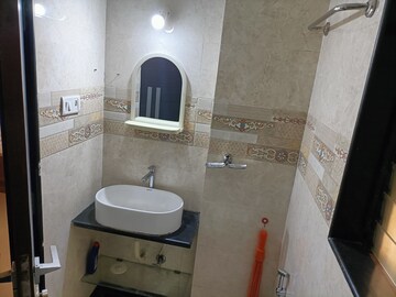 Bathroom in 2 BHK Apartment at Atul Blue Meadows, Andheri East – for Rent