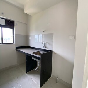 Kitchen in 1 BHK Apartment at Runwal Gardens Phase 2, Kalyan Shilphata Road – for Sale