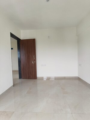 Room in 2 BHK Apartment at The Greenwoods CHS, Dhayari – for Sale