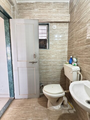 Bathroom in 2 BHK Apartment at Ramkrishna Paradise, Dhayari – for Sale