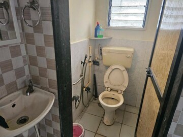 Bathroom in 1 BHK Apartment at New Jay Palace, Yari Road – for Rent