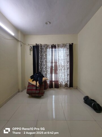 Living Room in 1 BHK Apartment at Shivratna CHS, Kalwa – for Rent