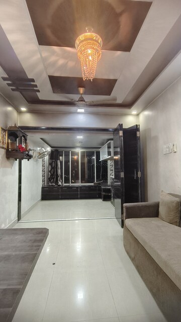Living Room in 1 BHK Apartment at Shanti Dham Heights, Parsik – for Rent