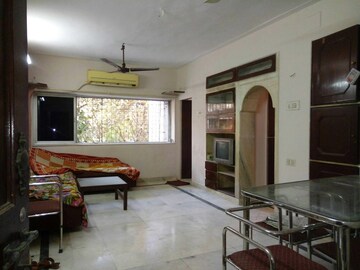 Living Room in 1 BHK Apartment at Juhu Tarang, Andheri West – for Rent