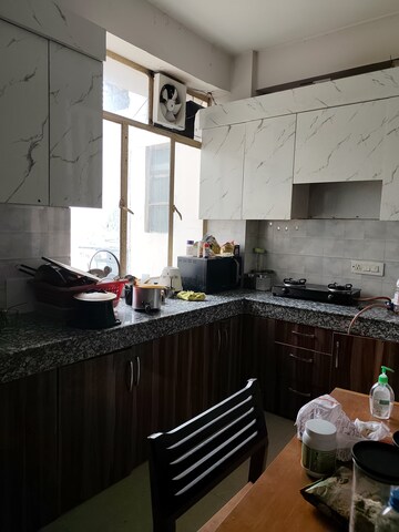 Kitchen in 2 BHK Apartment at Mahindra Aura, Sector 110a – for Rent