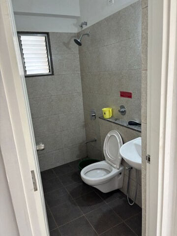 Bathroom in 3 BHK Apartment at Goyal Orchid Valley, Shela – for Rent