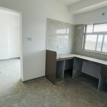 Kitchen in 1 BHK Apartment at Shraddha Evoque, Sonapur – for Sale