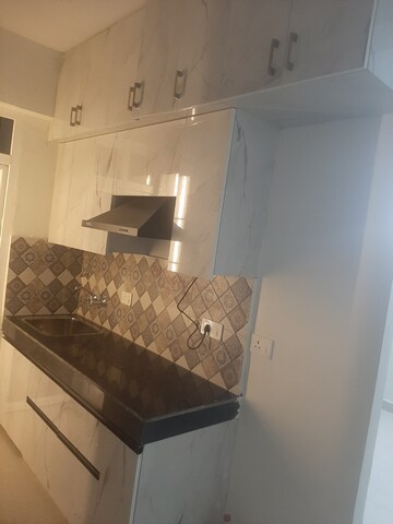 Kitchen in 1 BHK Apartment at Signature Global Golf Greens, Sector 79 – for Rent