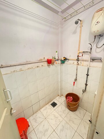 Bathroom in 1 BHK Apartment at Sunrise CHS Mhada, Goregaon East – for Rent
