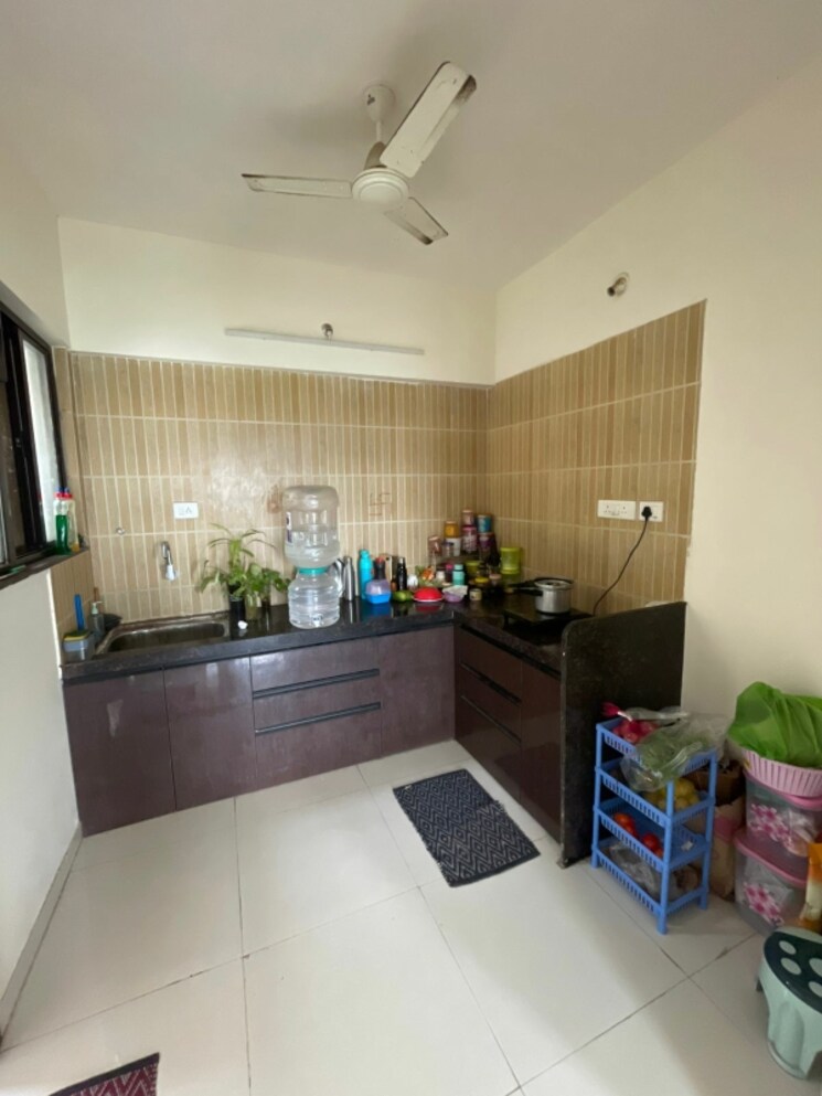 Kitchen, om-tropica 2 Bedroom 720 Sq.Ft. Apartment In Ravet Pune 9039052