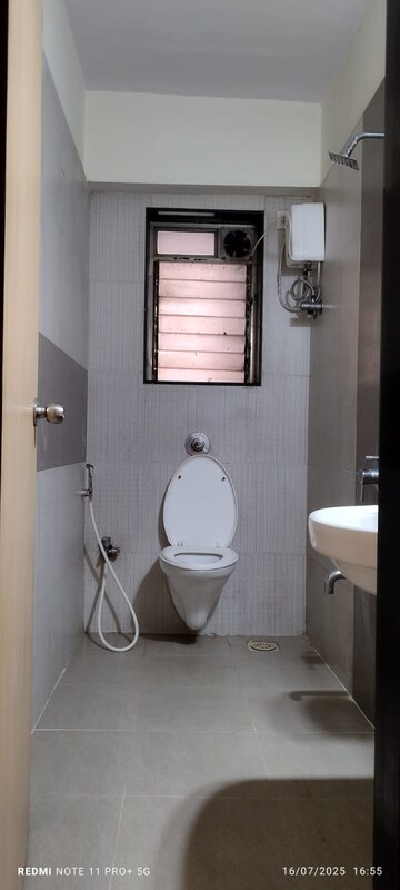 Bathroom in 1 BHK Apartment at Raunak Sai Dham Towers, Kandivali West – for Rent