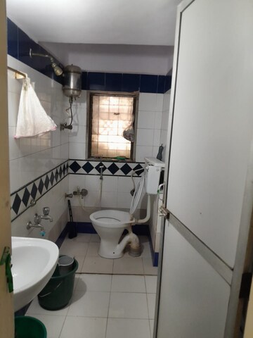 Kitchen in 2 BHK Apartment at Arihant Darshan CHS, Kandivali East – for Sale