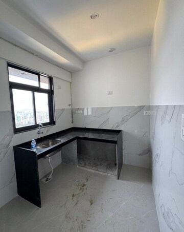 Kitchen in 2 BHK Apartment at Dev Leo Tower, Oshiwara – for Rent