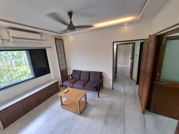 Living Room in 1.5 BHK Apartment at Bandra West – for Rent