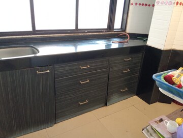 Kitchen in 1 BHK Apartment at Bindra Marigold CHS, Andheri East – for Rent