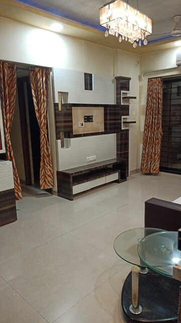 Living Room in 1 BHK Apartment at K Raheja Heights, Malad East – for Rent