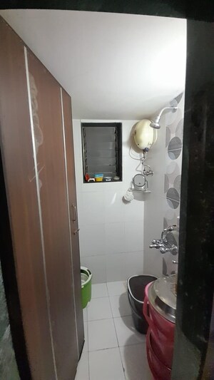 Bathroom in 1 BHK Apartment at Lumbini CHS, Khar West – for Sale