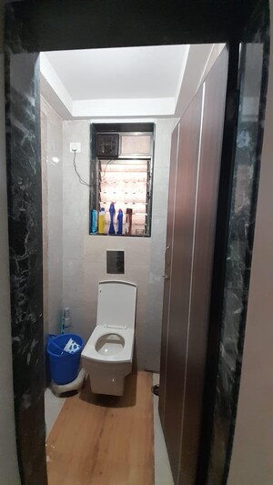 Bathroom in 1 BHK Apartment at Lumbini CHS, Khar West – for Sale