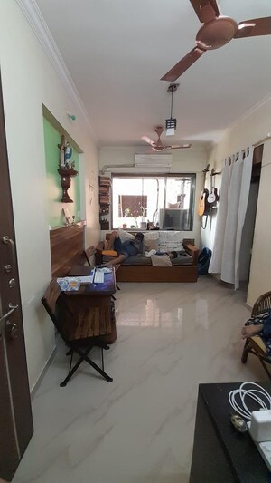 Living Room in 1 BHK Apartment at Lumbini CHS, Khar West – for Sale