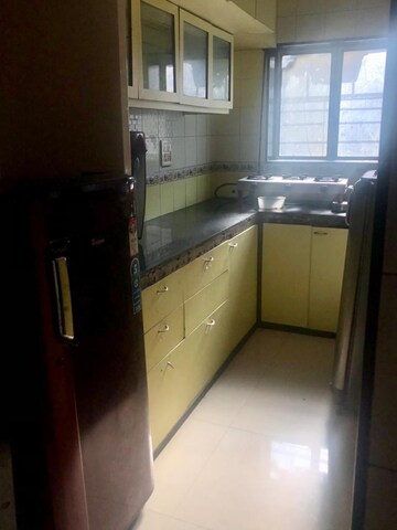 Kitchen in 2 BHK Apartment at Aroma CHS, Andheri West – for Rent