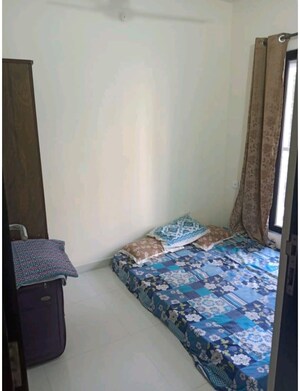 Bedroom in 1 BHK Apartment at Dosti Desire Joy, Brahmand – for Sale