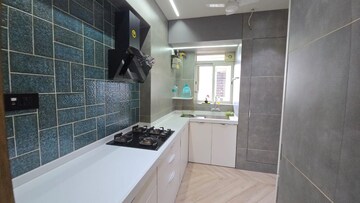 Kitchen in 5 BHK Apartment at Kalpataru Siddhachal Elite, Vasant Vihar – for Sale