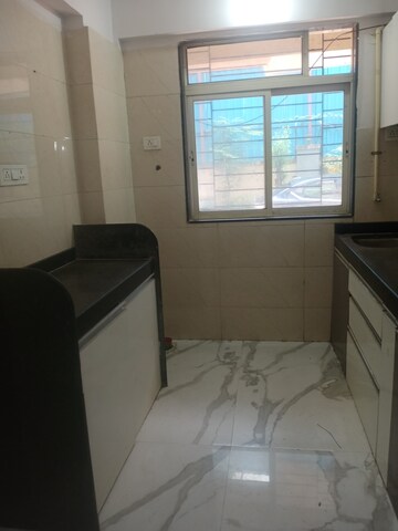 Kitchen in 1 BHK Apartment at RNA NG VIBRANCY, Mira Road – for Sale