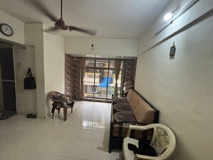 Living Room in 1 BHK Apartment at Kandur Aman, Kandivali East – for Sale