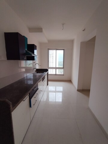 Kitchen in 2 BHK Apartment at Puranik Rumah Bali, Ghodbunder Road – for Sale