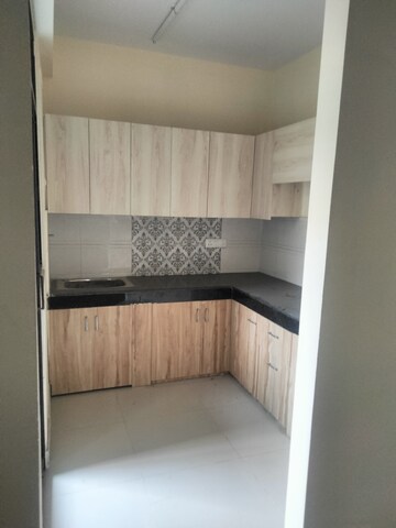 Kitchen in 3 BHK Apartment at Charms Castle Phase II, Raj Nagar Extension – for Sale