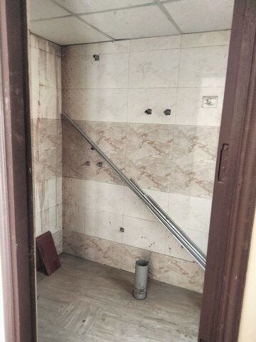 Bathroom in 3 BHK Apartment at Charms Castle Phase II, Raj Nagar Extension – for Sale