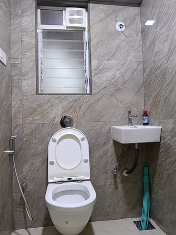Bathroom in 1 BHK Apartment at Kanak Heights Geeta Bhavan CHS, Malad East – for Rent