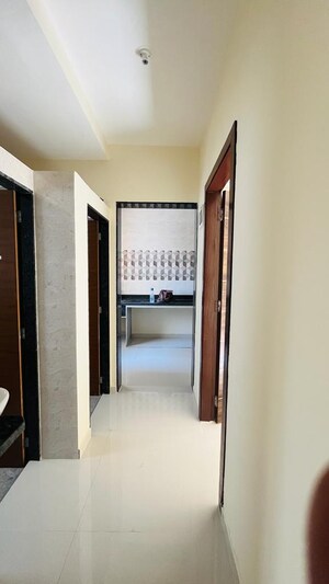 Building Lobby in 1 BHK Apartment at Empire Homes, Ambernath – for Rent