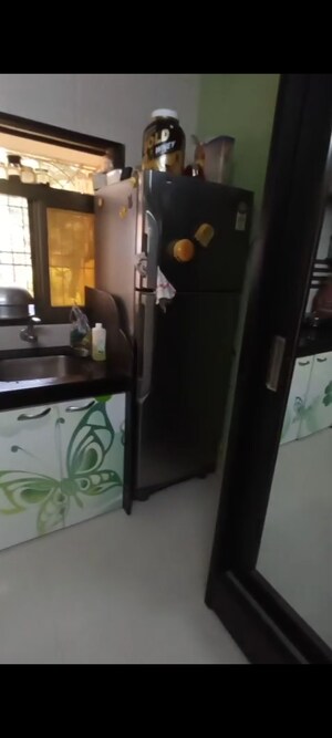 Kitchen in 1 BHK Apartment at Krishna Nagari Niwara CHS, Goregaon East – for Sale