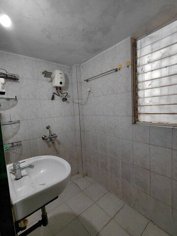 Bathroom in 1 BHK Apartment at Link Plaza Malad, Malad West – for Rent