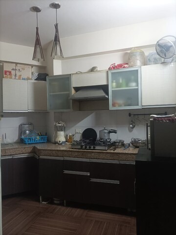 Kitchen in 2 BHK Apartment at Paramount Symphony, Sain Vihar – for Sale