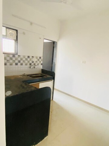 Kitchen in 2 BHK Apartment at Raj Heramba Venkatesh Imperia, Tathawade – for Rent