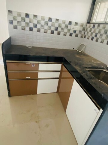 Kitchen in 2 BHK Apartment at Raj Heramba Venkatesh Imperia, Tathawade – for Rent